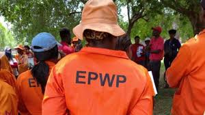 EPWP workers in orange uniforms standing together, representing the City of Johannesburg's Jozi Ihlomile Educators program.