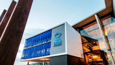 Exterior of a building displaying a blue logo, advertising job openings for packers at RCL Foods.