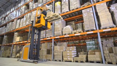 A forklift is actively relocating boxes in a warehouse, showcasing exciting career opportunities in logistics and warehousing.
