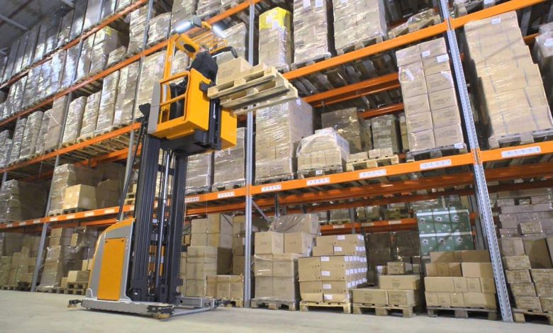 A forklift is actively relocating boxes in a warehouse, showcasing exciting career opportunities in logistics and warehousing.