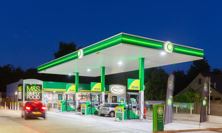 A BP gas station illuminated at night, with a car passing by, highlighting the Learnership Programs offered.